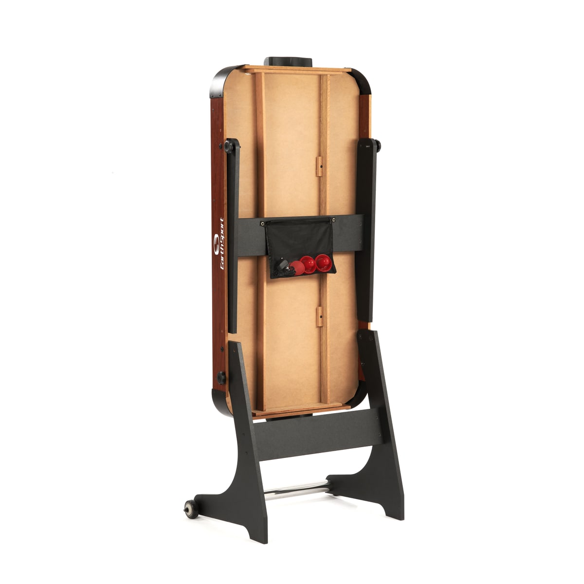 Underside of the folded EarthSport air hockey table, showing the accessory pouch holding the strikers and pucks.